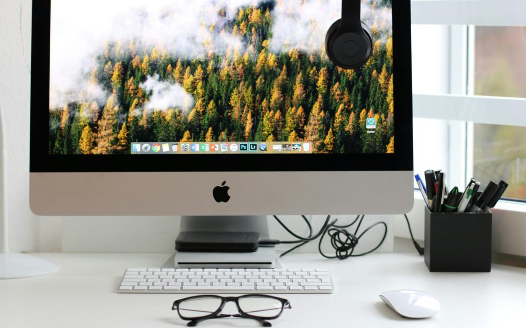 Free Stylish home office workspace featuring a computer setup with accessories. Stock Photo